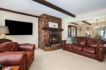 Family room with comfortable leather sofas and a flat screen smart TV